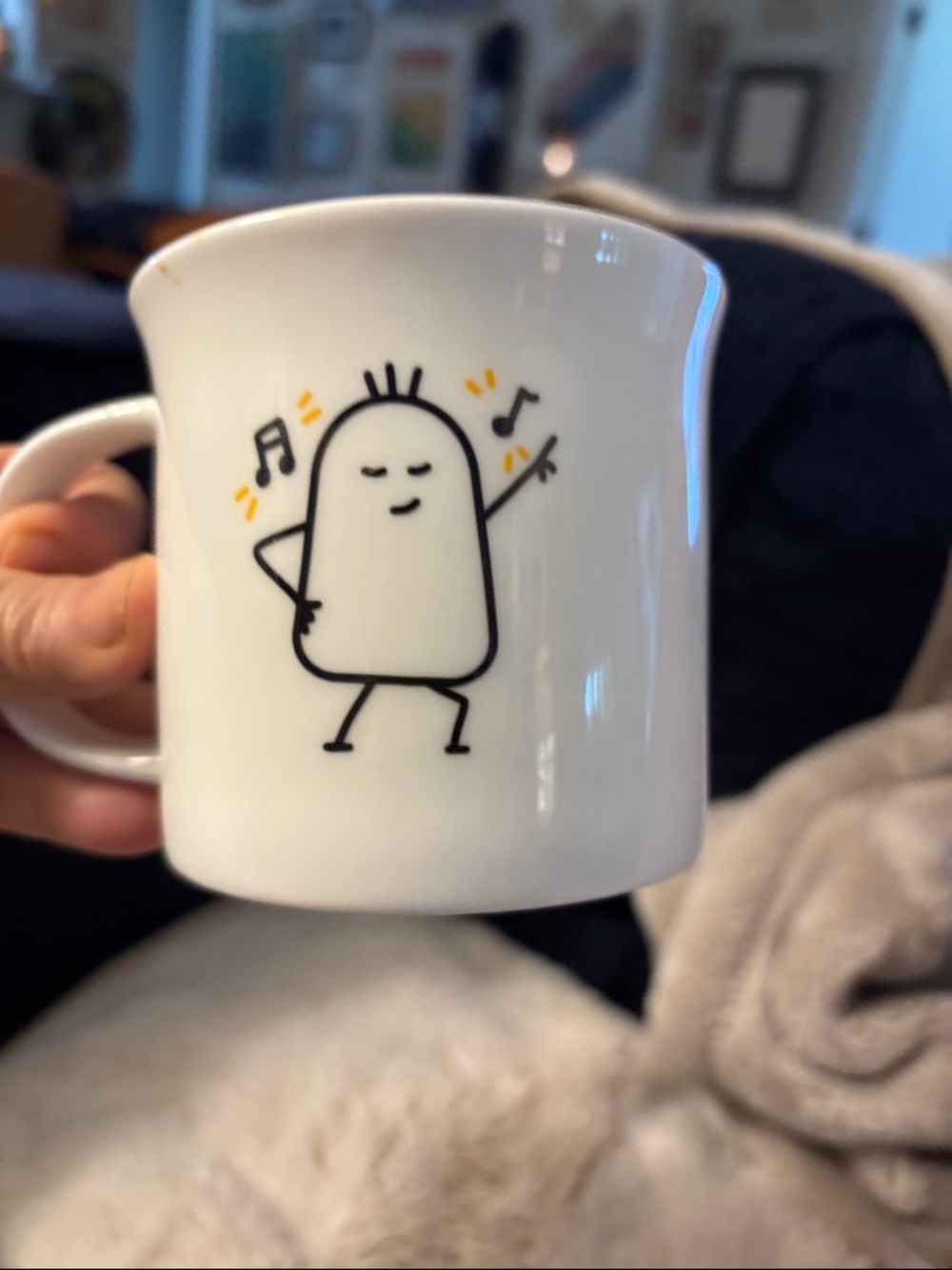 Pazabaha  White porcelain Mug with Playful Dancing Character and Yellow Accents